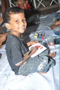 A kid looking very happy during the workshop