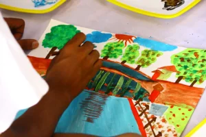 A kid painting a bridge