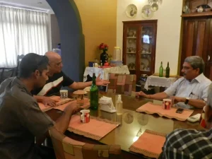 Armando Gonsalves and Parrikar chat at the dining hall of the Gonsalves Mansion before heading to the conference