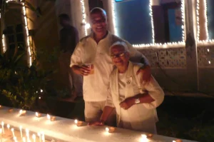Armando Gonsalves and his mother Aduzinda, pose for a picture after lighting some candles on their compound wall at the Mansion!