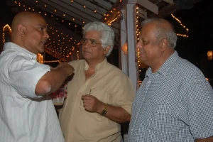 Armando Gonsalves putting a point strongly across to his friends Ramakant Khalap and Trevor Fernandes