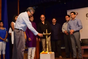 Eminent Surgeon Dr Bossuet Afonso is seen lighting the traditional lamp_