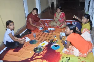 Kids sitting around in the verandah of the Gonsalves Masnion