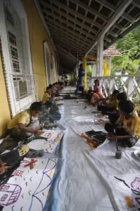 Kids gather in the verandah of the Gonsalves Mansion
