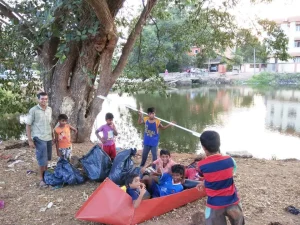 Children at Camara bhat, getting ready to enter the shallow section of the Campal Creek a k a St Inez Creek