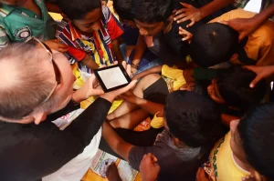 kids looking at the kindle introduced by Stephen McCarty